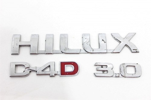 Emblema Logo Porta Jg Hilux 05/15 Usado (000)