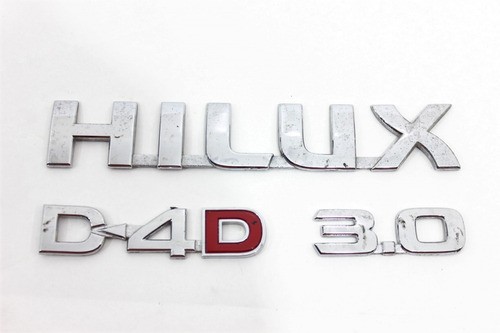 Emblema Logo Porta Jg Hilux 05/15 Usado (999)