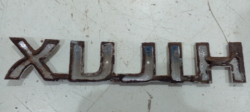 Emblema Tampa Traseira Toyota Hilux 2005/15 754270k010 (r)