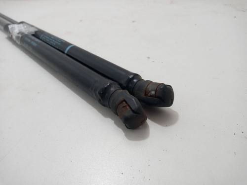 Par/amortecedor Tampa Traseira Vw Golf 1999/2014 Original